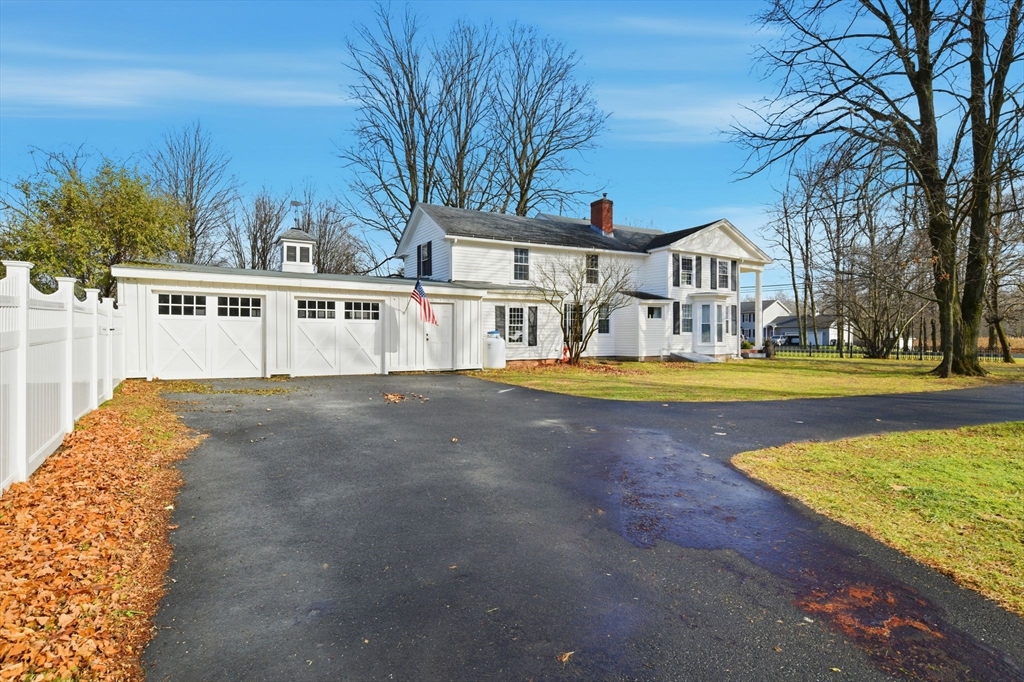 271 North Grand Street Suffield, CT 06093 - Photo 4 of 42 a view of swimming pool with outdoor seating and trees in the background