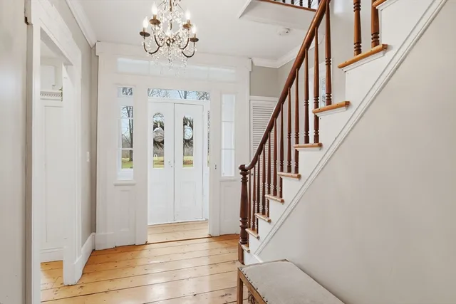 a view of entryway with wooden floor