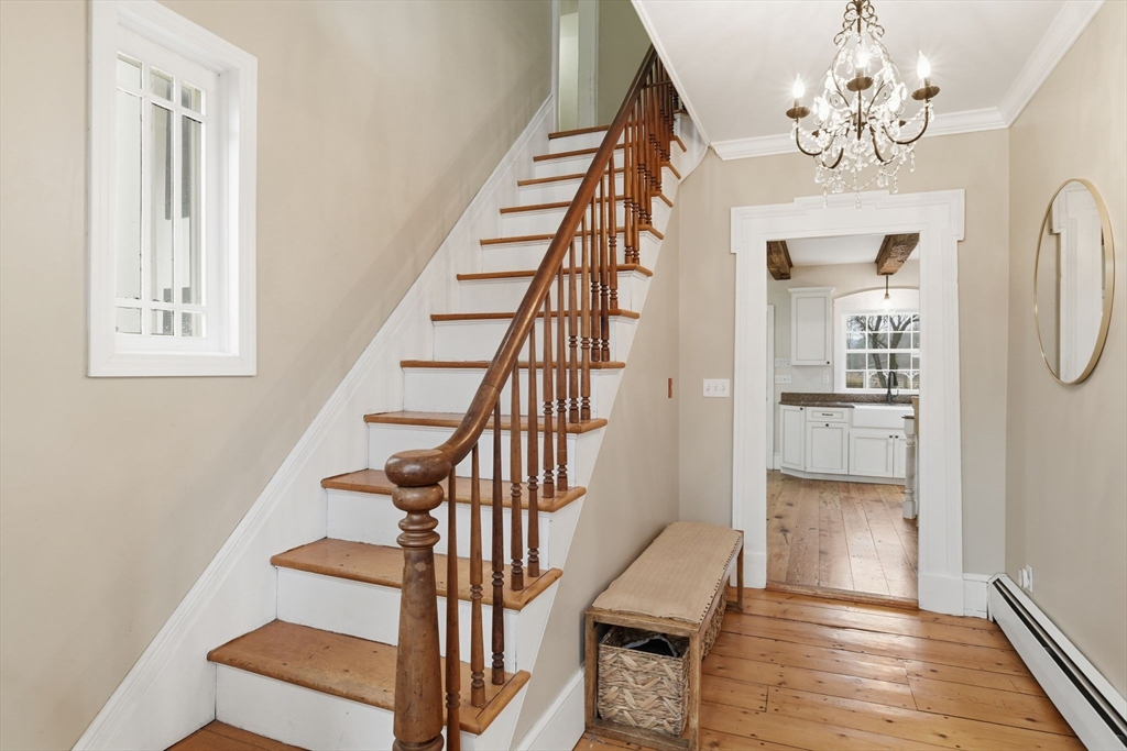 271 North Grand Street Suffield, CT 06093 - Photo 6 of 42 a view of entryway and hall with wooden floor