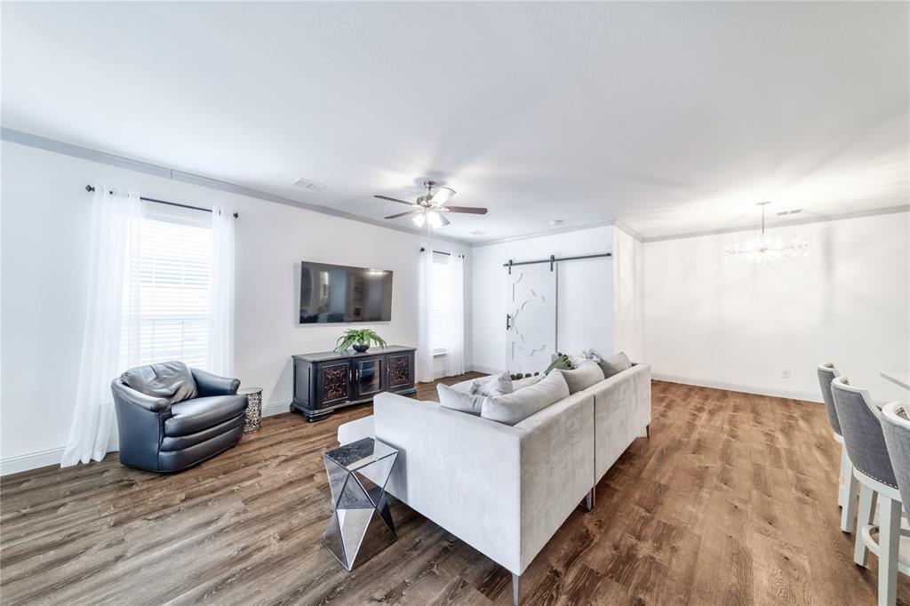 201 Brookview Drive Lavon, TX 75166 - Photo 11 of 33 a living room with furniture and a flat screen tv