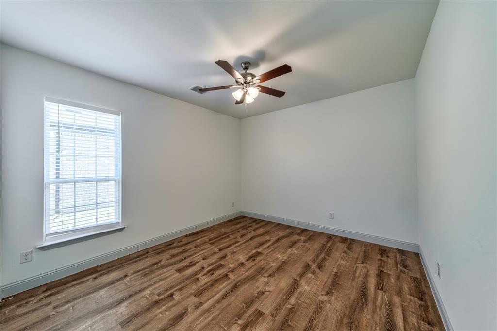 201 Brookview Drive Lavon, TX 75166 - Photo 15 of 33 wooden floor in an empty room with a window