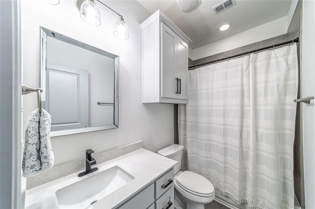 201 Brookview Drive Lavon, TX 75166 - Photo 16 of 33 a bathroom with a sink toilet and shower