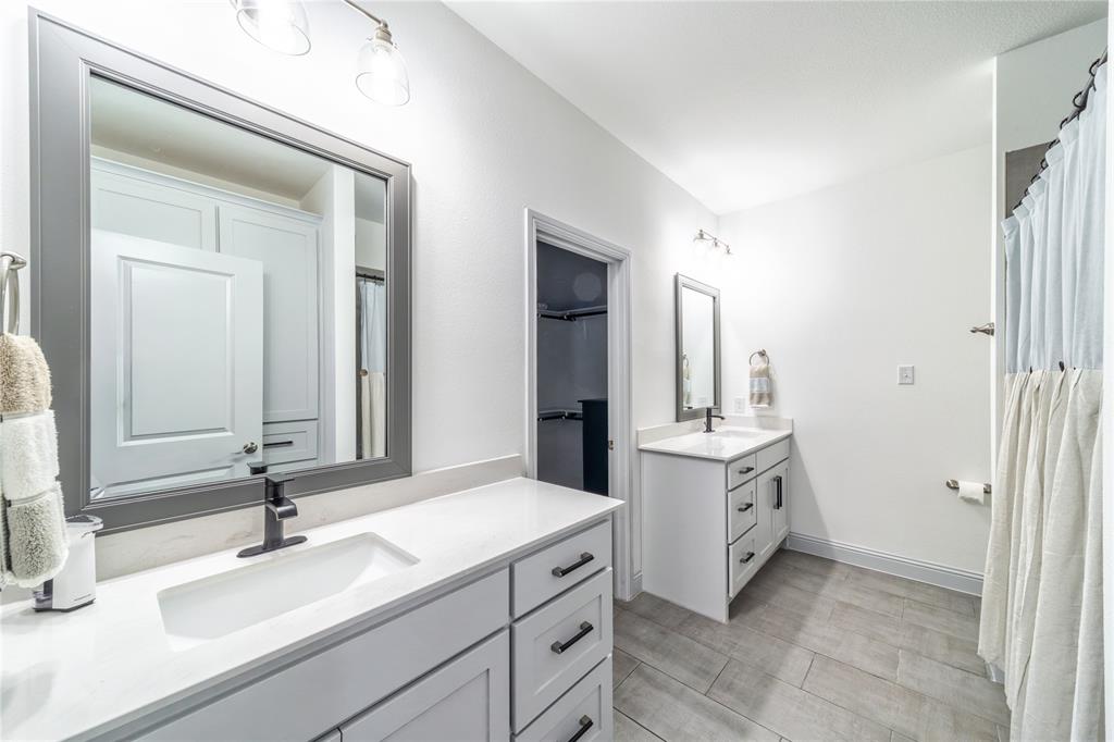 201 Brookview Drive Lavon, TX 75166 - Photo 24 of 33 a bathroom with a sink and a mirror