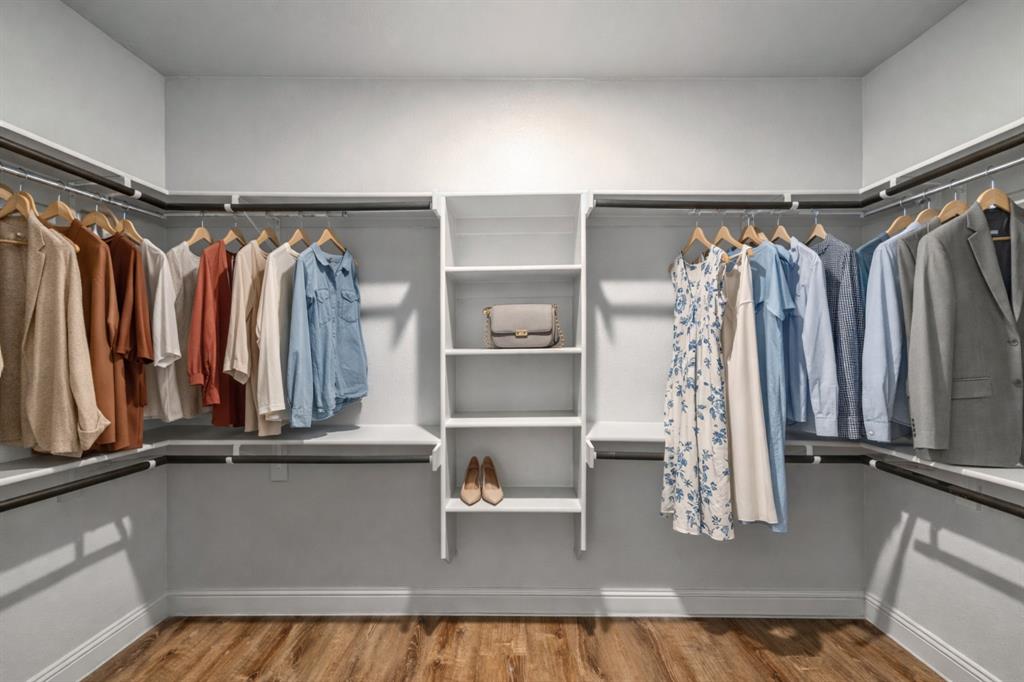 201 Brookview Drive Lavon, TX 75166 - Photo 26 of 33 a view of walk in closet with clothes