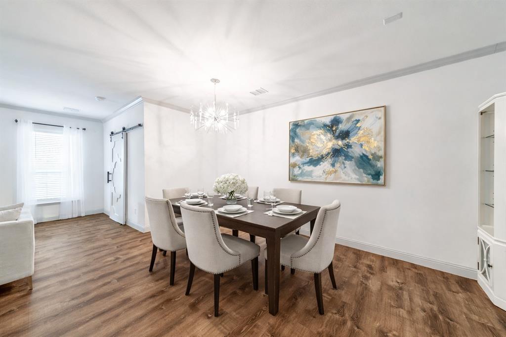 201 Brookview Drive Lavon, TX 75166 - Photo 3 of 33 a view of a dining room with furniture and wooden floor