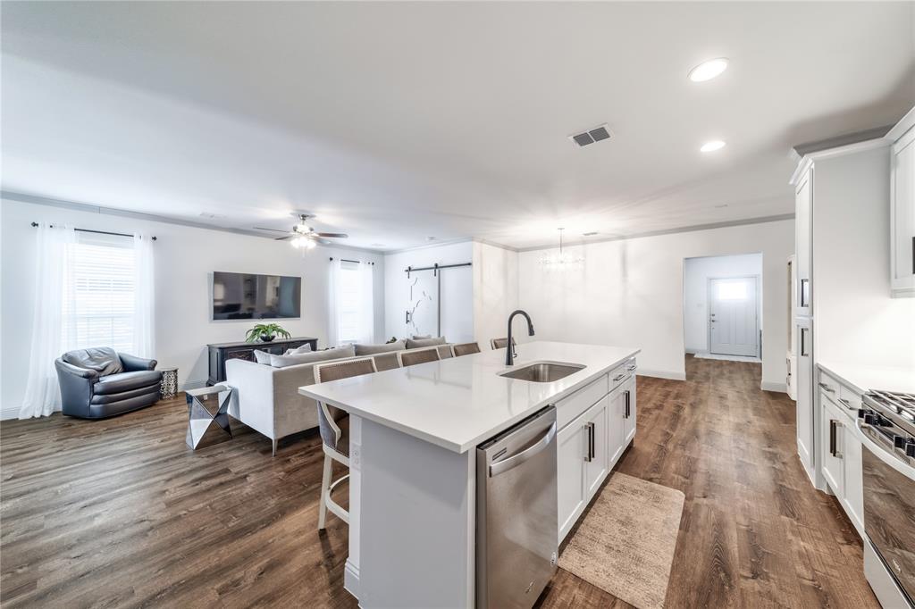 201 Brookview Drive Lavon, TX 75166 - Photo 8 of 33 a large white kitchen with a large window
