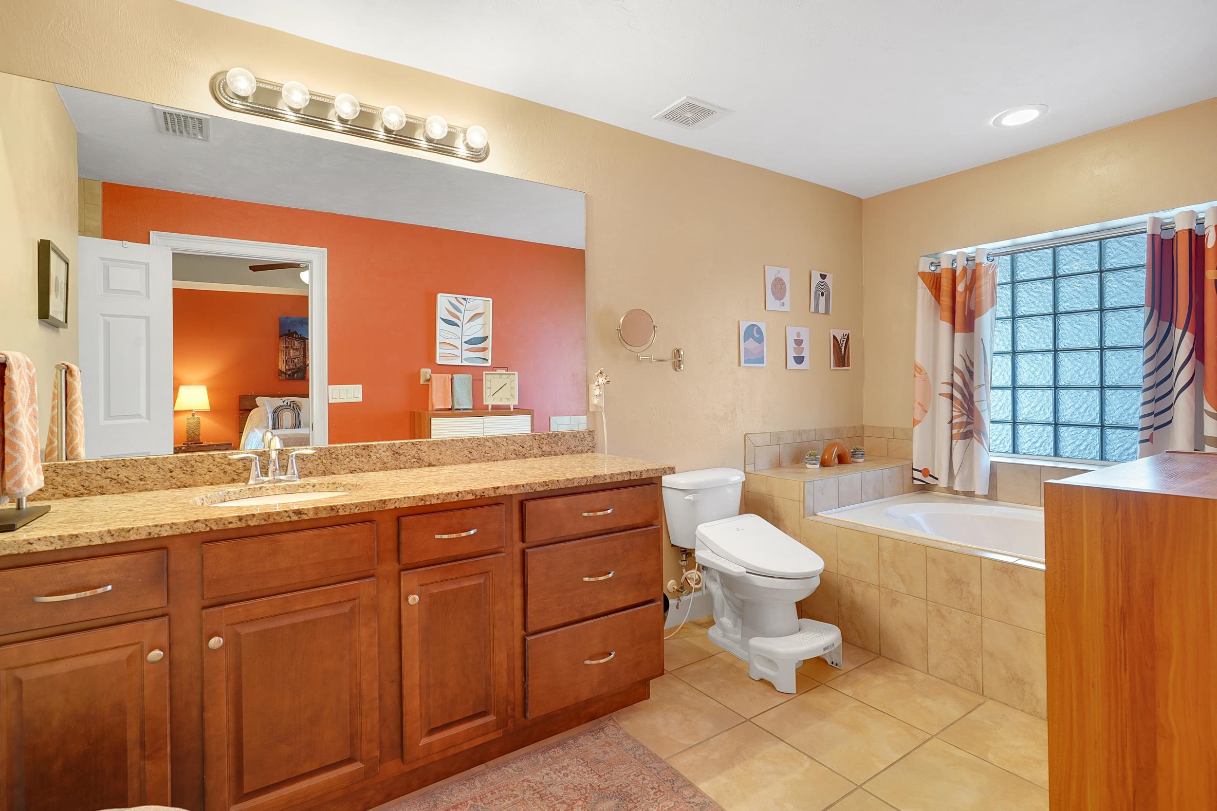 121 Harrison Road Daytona Beach, FL 32118 - Photo 21 of 48 a bathroom with a double vanity sink toilet and a mirror