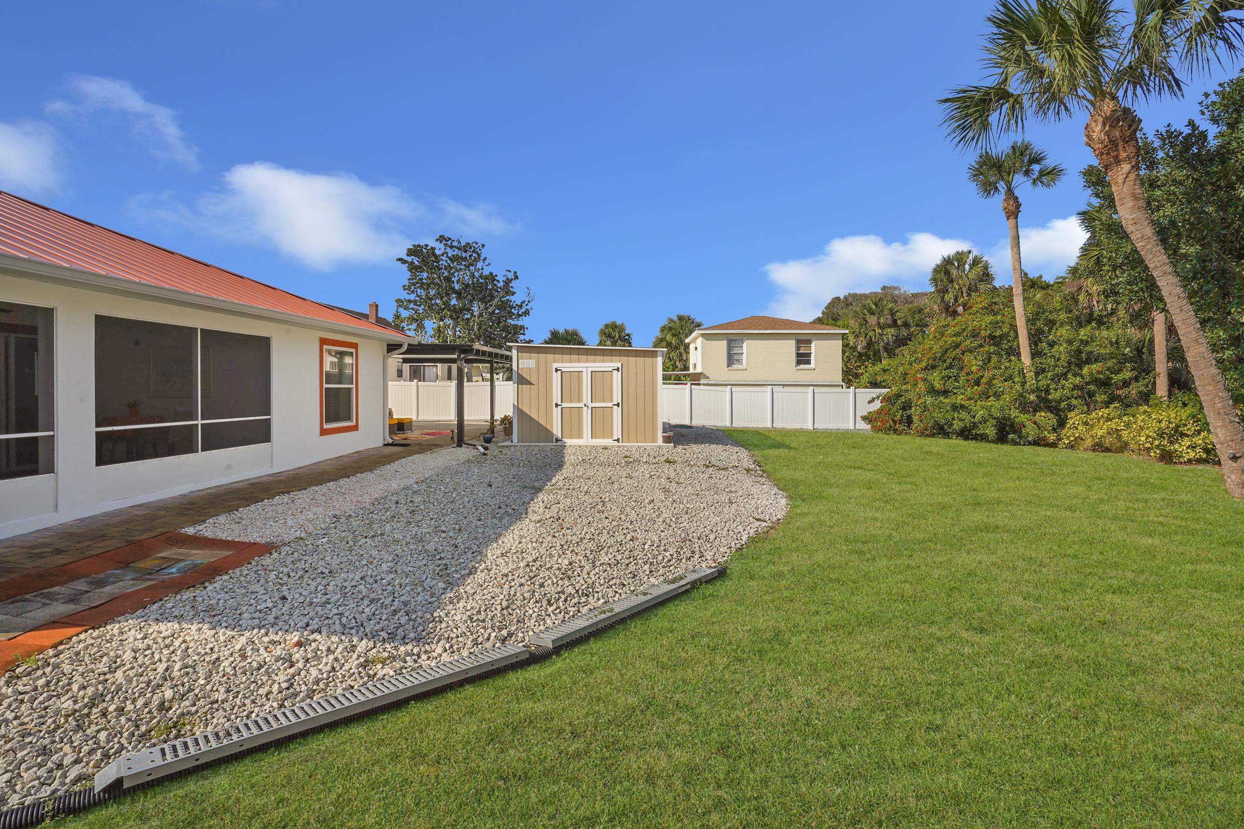 121 Harrison Road Daytona Beach, FL 32118 - Photo 32 of 48 a view of a house with a yard and potted plants