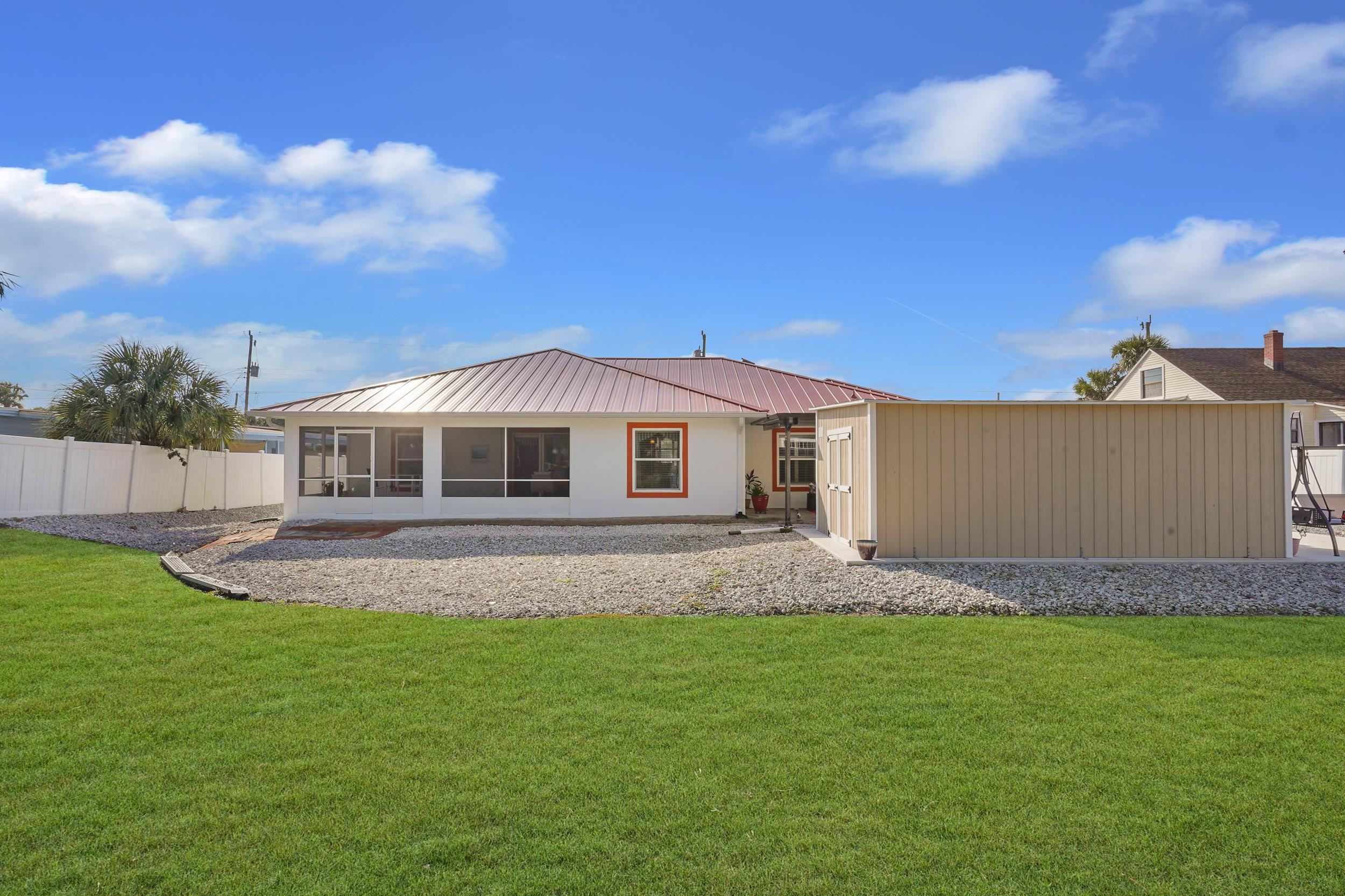 121 Harrison Road Daytona Beach, FL 32118 - Photo 34 of 48 a front view of a house with a garden