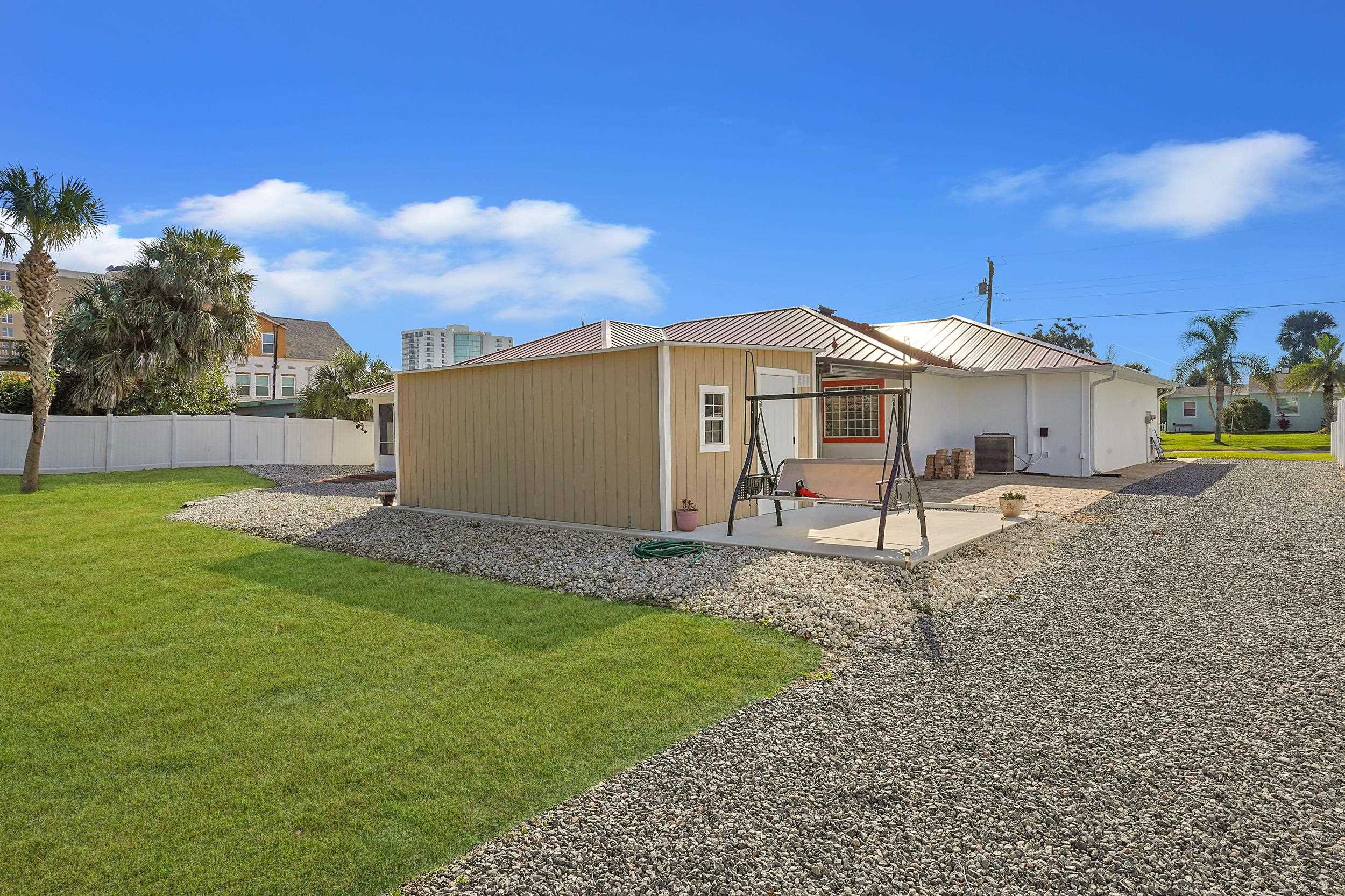 121 Harrison Road Daytona Beach, FL 32118 - Photo 35 of 48 a house with garden in front of it