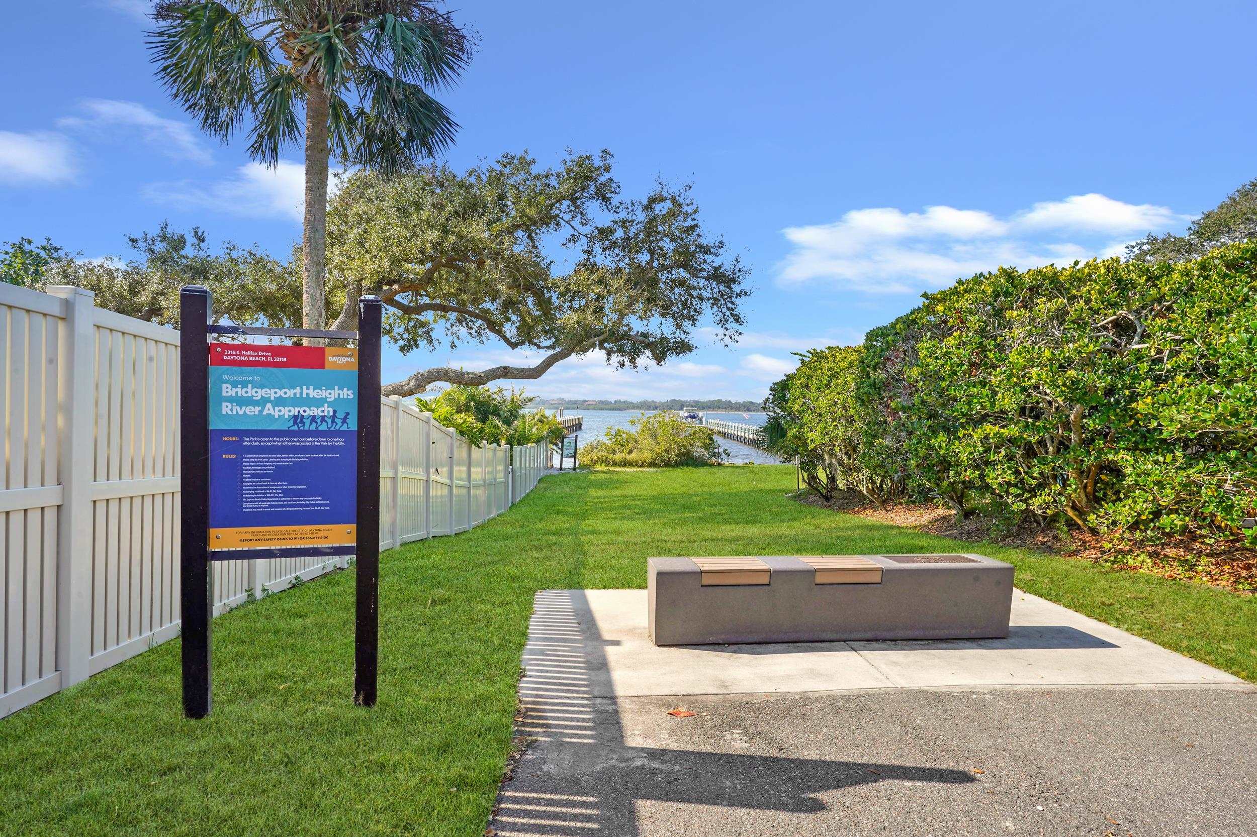 121 Harrison Road Daytona Beach, FL 32118 - Photo 47 of 48 a green field with some trees in the background