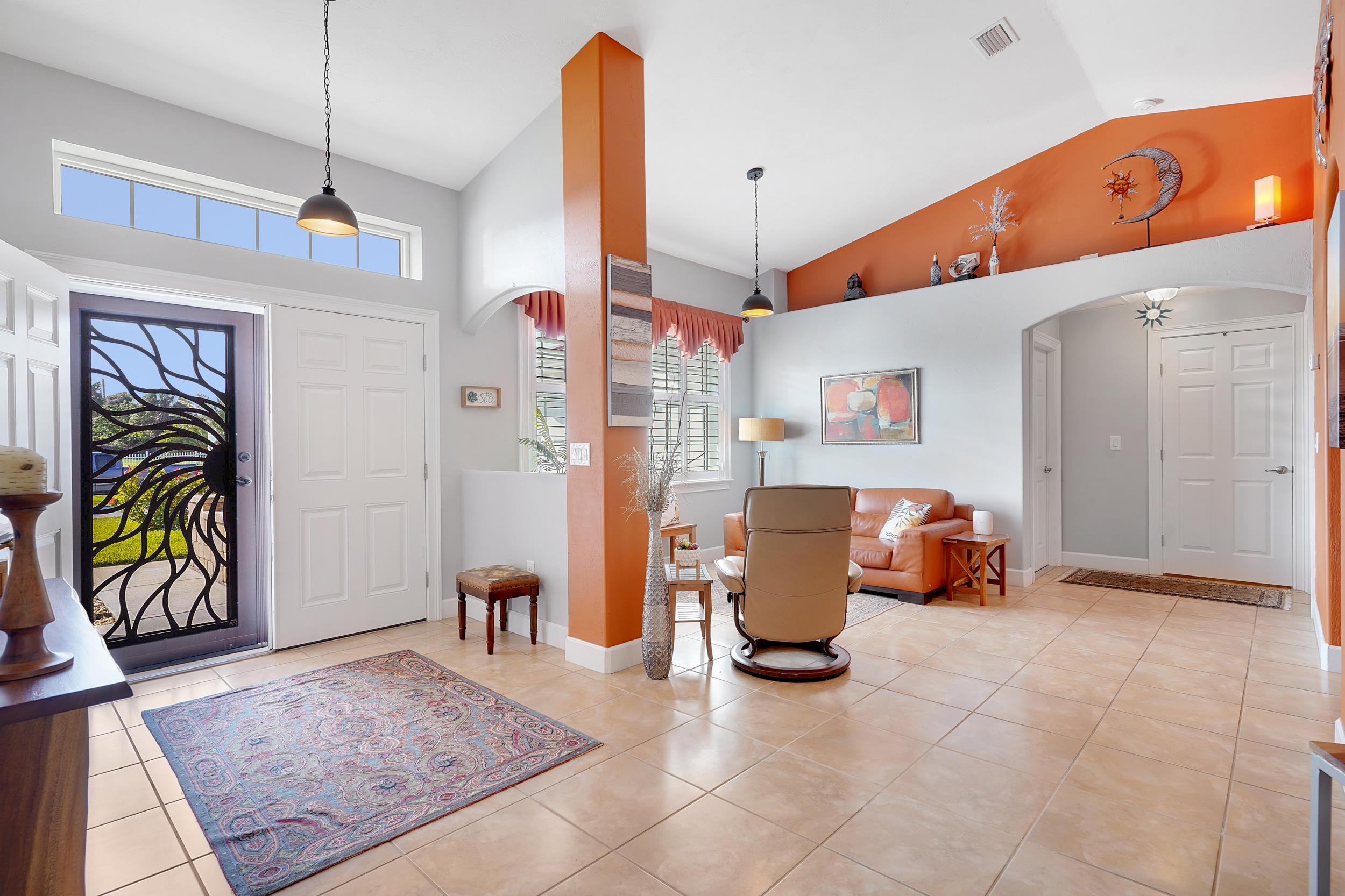 121 Harrison Road Daytona Beach, FL 32118 - Photo 7 of 48 a living room with furniture and a chandelier