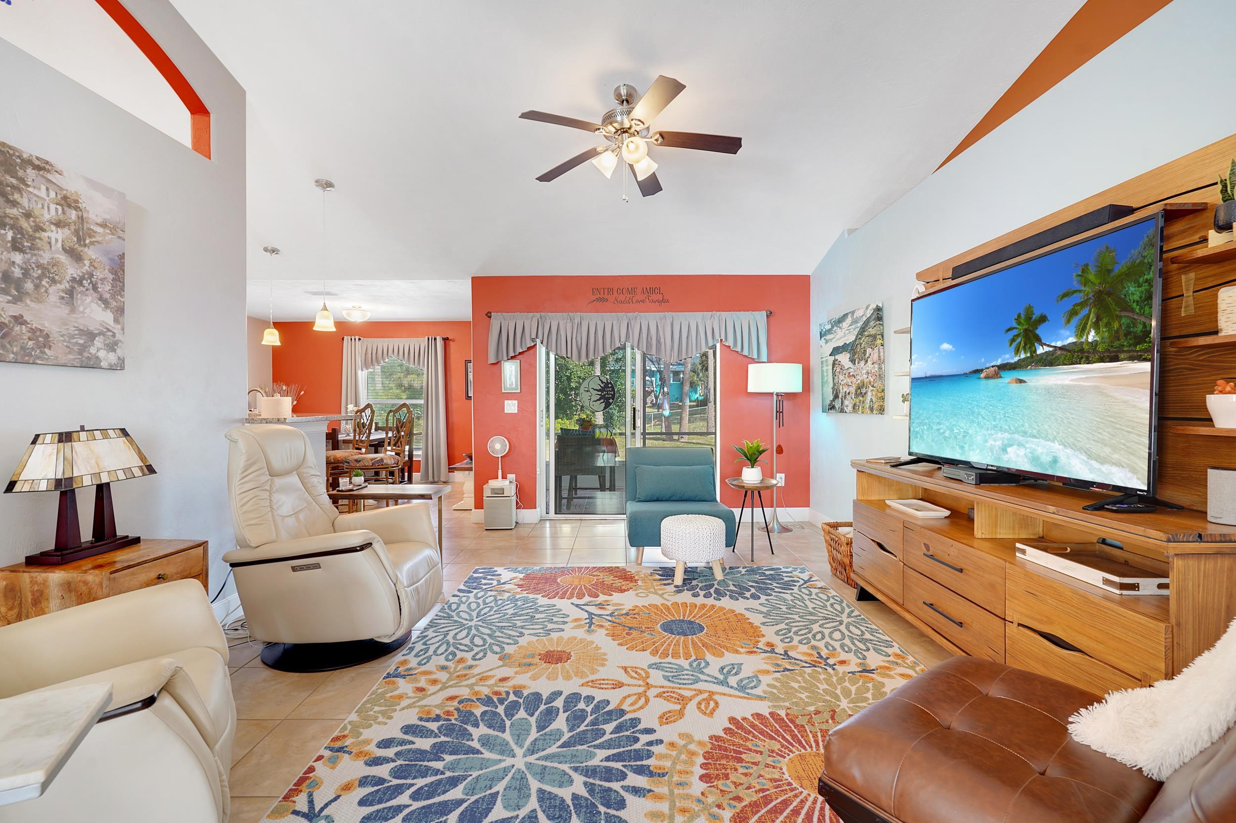 121 Harrison Road Daytona Beach, FL 32118 - Photo 8 of 48 a living room with furniture and a flat screen tv