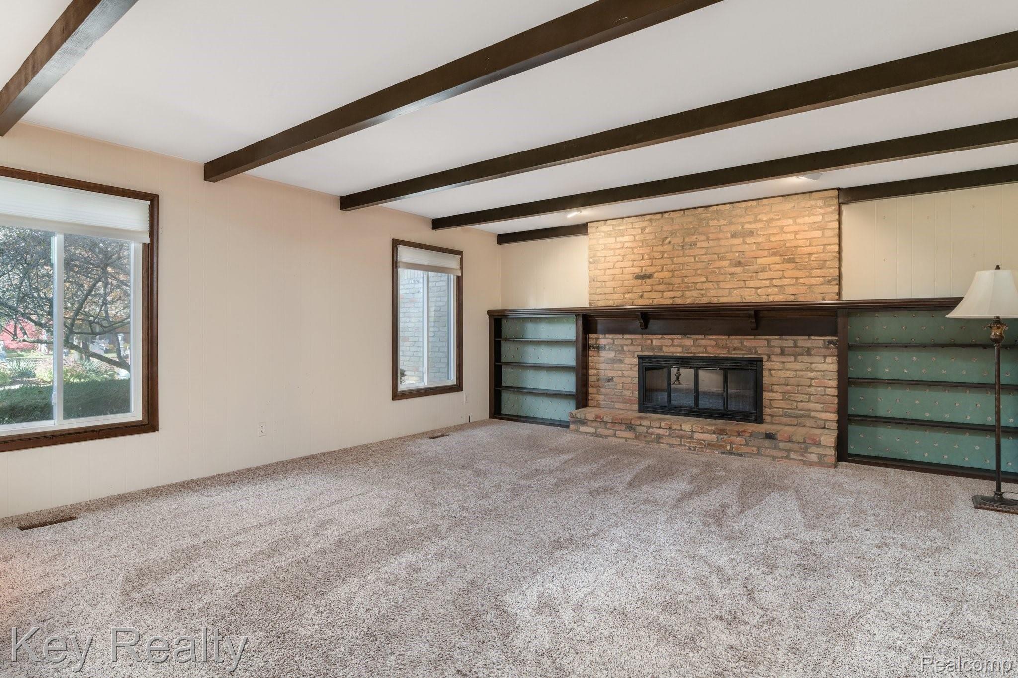 6231 Kings Shire Road Grand Blanc, MI 48439 - Photo 18 of 39 Large fire lit family room!