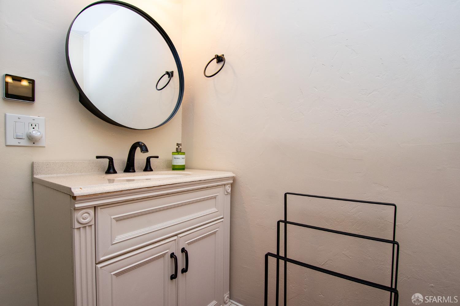 40 Encina Avenue Monterey, CA 93940 - Photo 18 of 23 a bathroom with a sink and a mirror