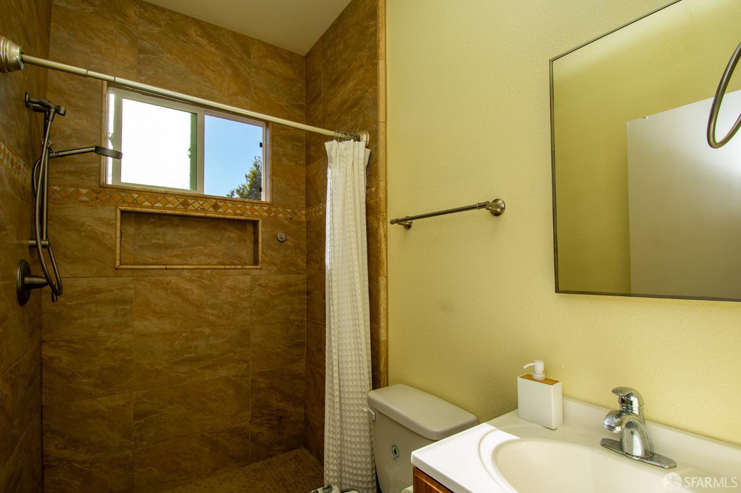 40 Encina Avenue Monterey, CA 93940 - Photo 20 of 23 a bathroom with a shower and a sink