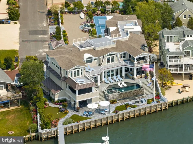 an aerial view of a house with a ocean view