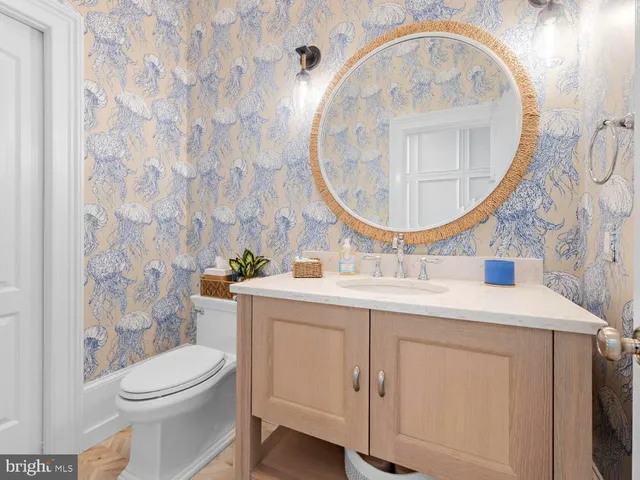 a bedroom with furniture and a flat screen tv