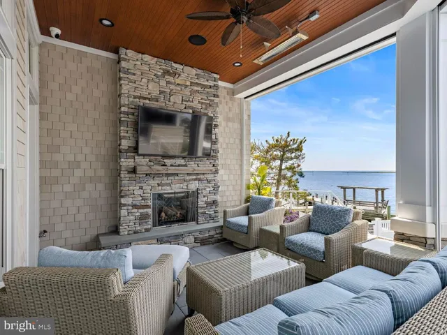 a room with pool table and windows