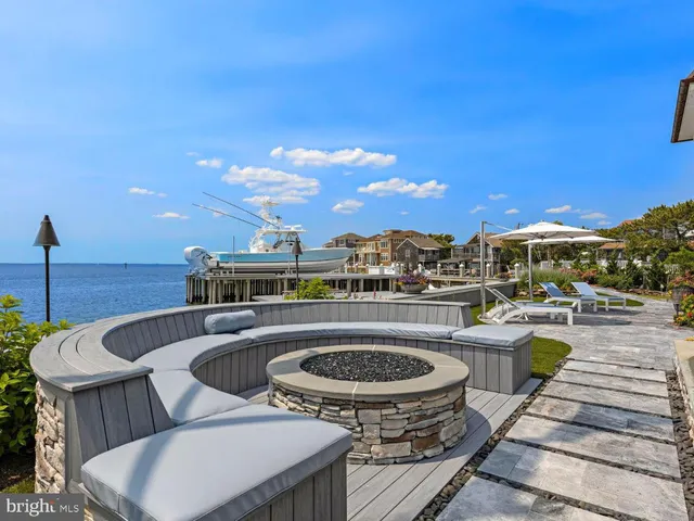 a bedroom with a bed and a flat tv screen on dresser