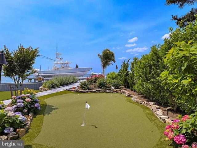 a bed room with a bed and a chandelier
