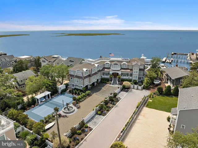 a living room with fireplace furniture and a chandelier