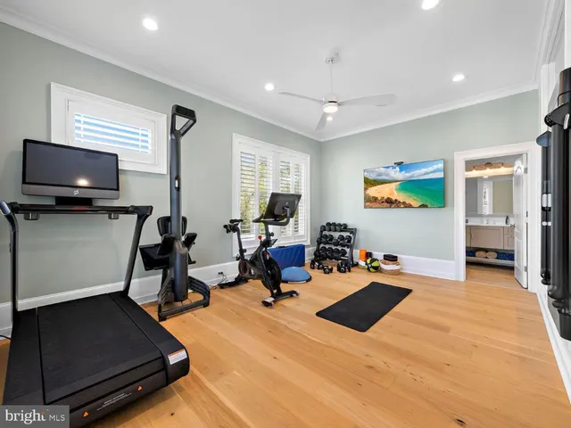 a view of a roof deck with table and chairs with wooden floor