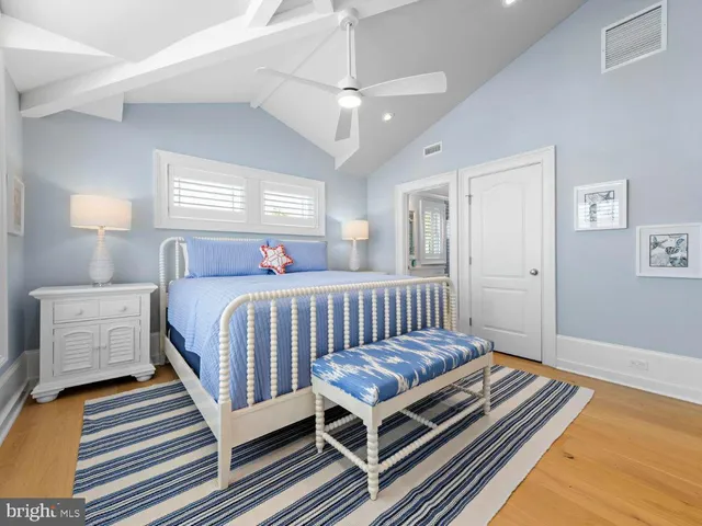 a bathroom with a sink shower and a mirror