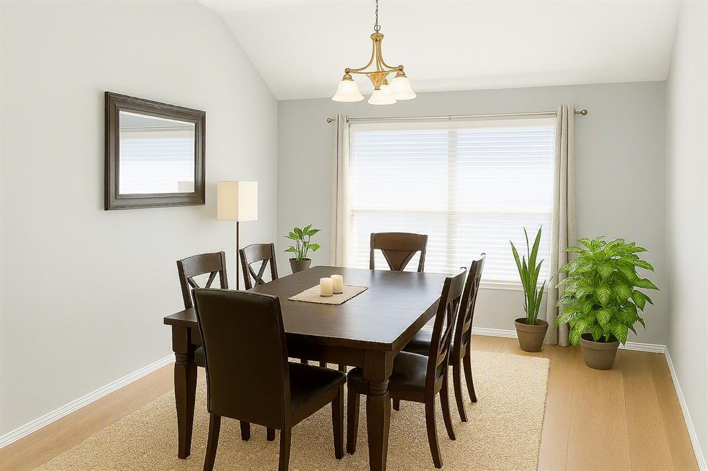 13153 Fencerow Road Fort Worth, TX 76244 - Photo 2 of 16 Dining area featuring vaulted ceilings, wood-finish flooring, and a window with blinds and drapes