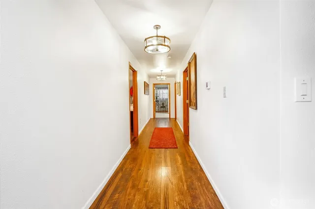 a bathroom with a granite countertop sink toilet tub and shower