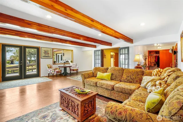 a living room with furniture and a rug