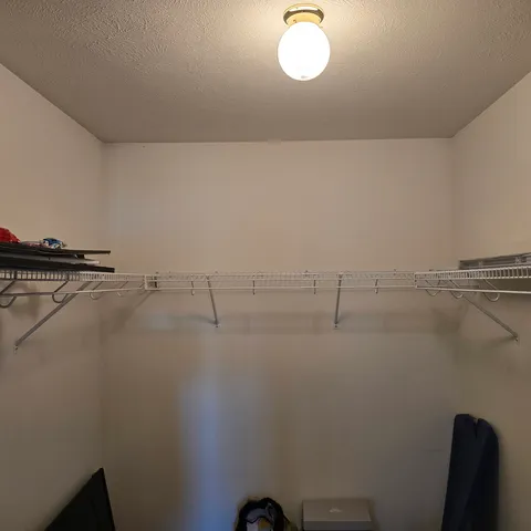 a view of a room with racks on the wall