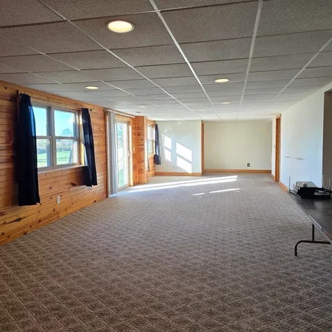 a view of an empty room with a fireplace