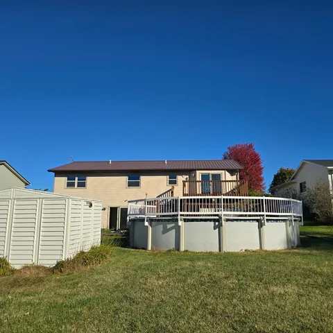 a view of a house with a fence