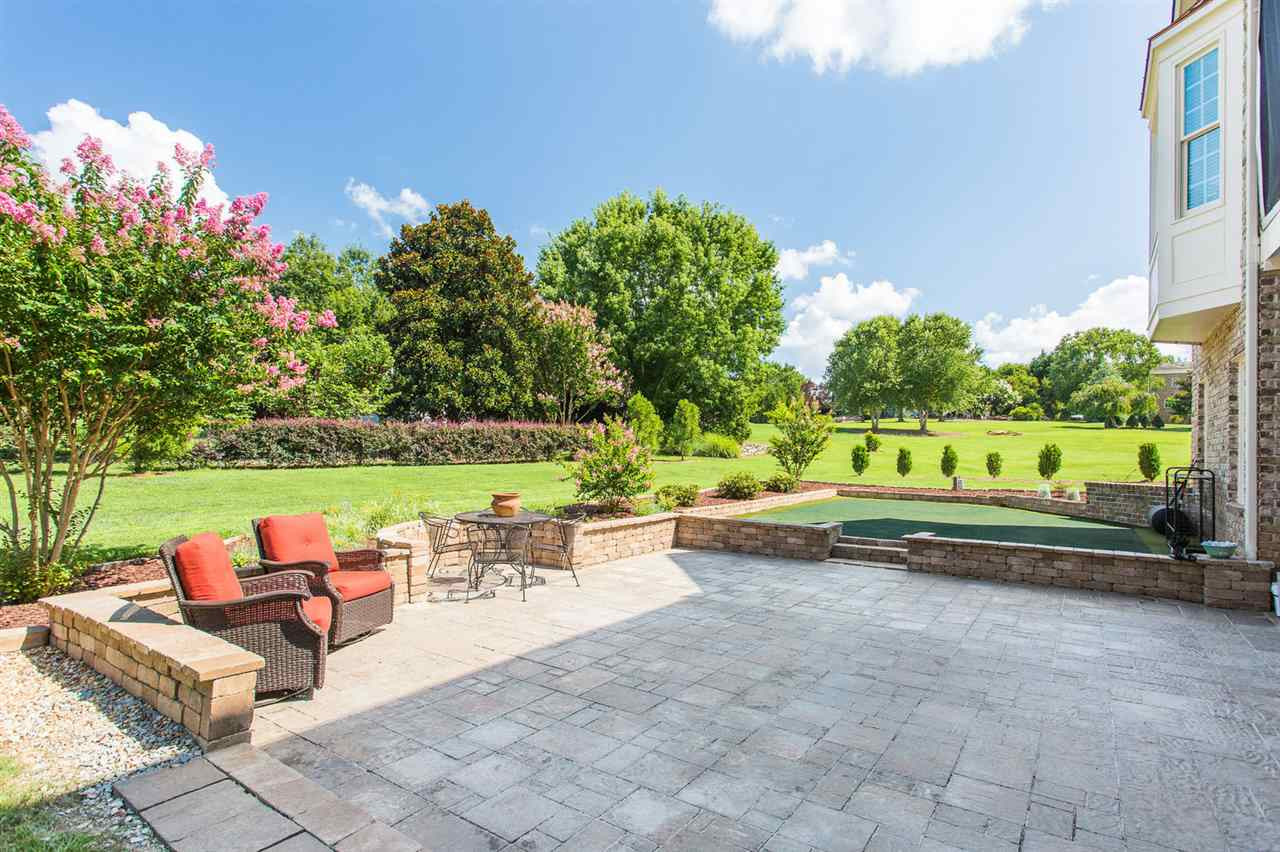 12404 Bayleaf Church Road Raleigh, NC 27614 - Photo 23 of 25 Enjoy the back patio, take in the view and practice your putting skills right at home! Backyard View