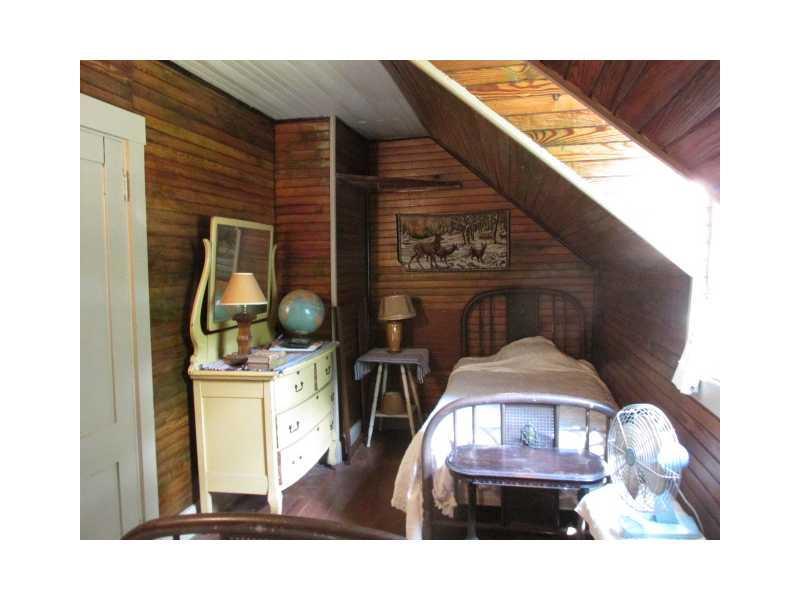 363 Bunker Hill Road Lagrange, ME 04453 - Photo 16 of 25 Bedroom. Quaint country bedroom