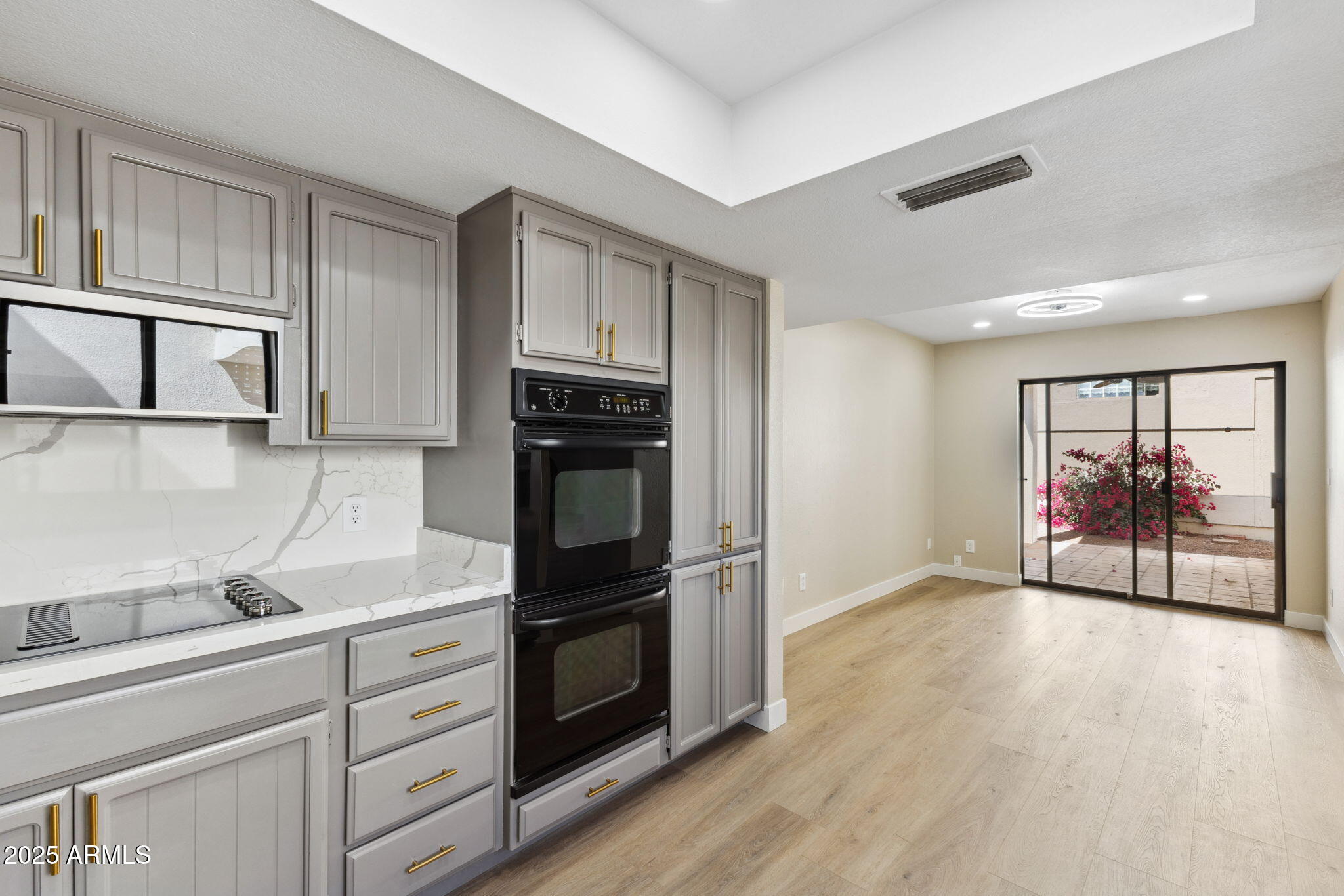 5310 North 24th Place Phoenix, AZ 85016 - Photo 11 of 35 a kitchen with granite countertop a stove and a refrigerator