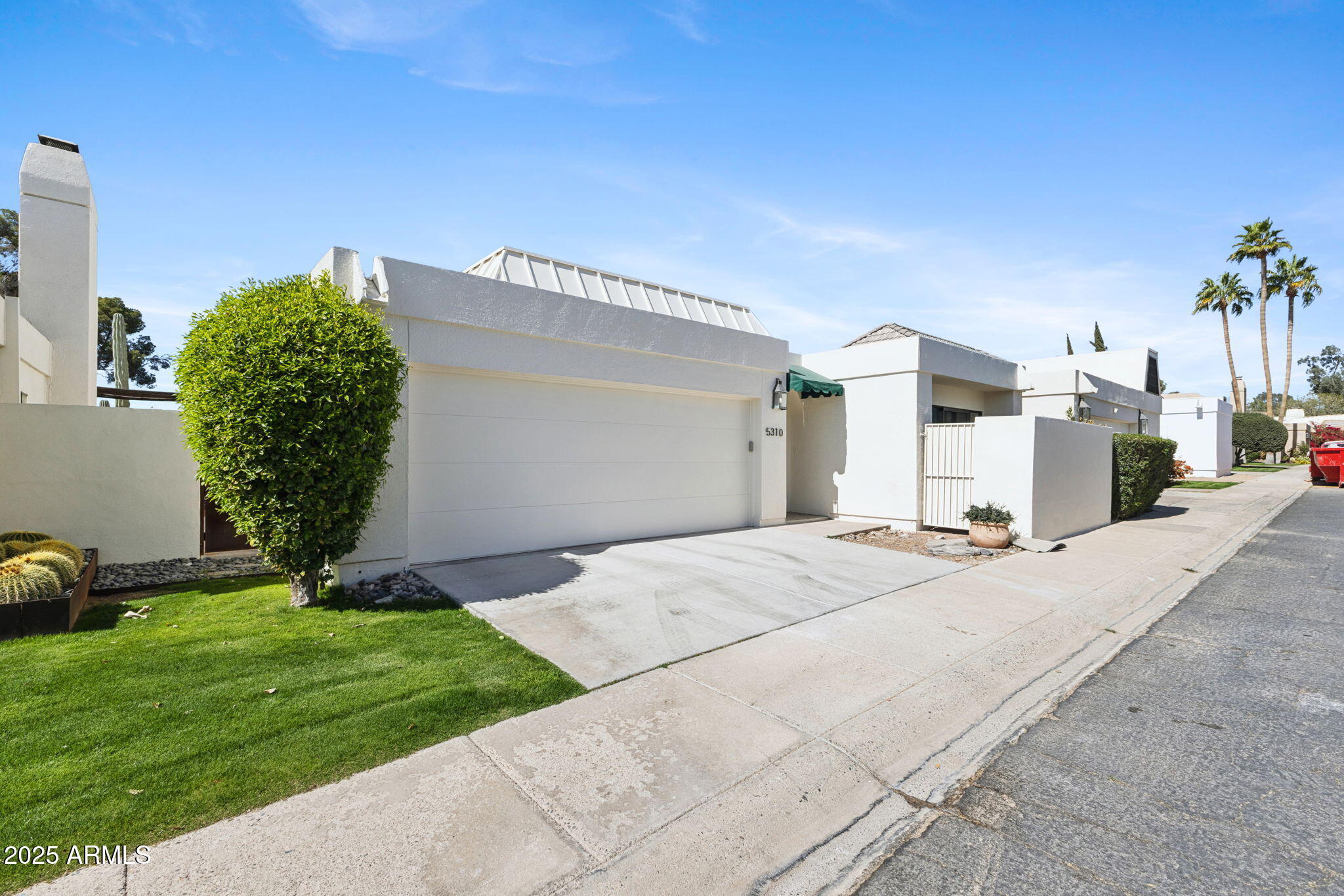 5310 North 24th Place Phoenix, AZ 85016 - Photo 2 of 35 a view of a backyard with plants and a barbeque