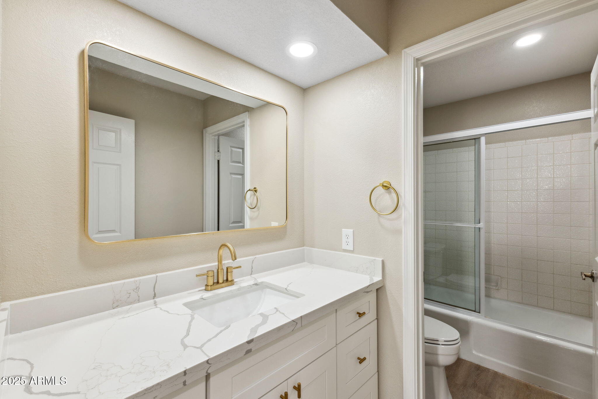 5310 North 24th Place Phoenix, AZ 85016 - Photo 24 of 35 a bathroom with a granite countertop sink a toilet and shower