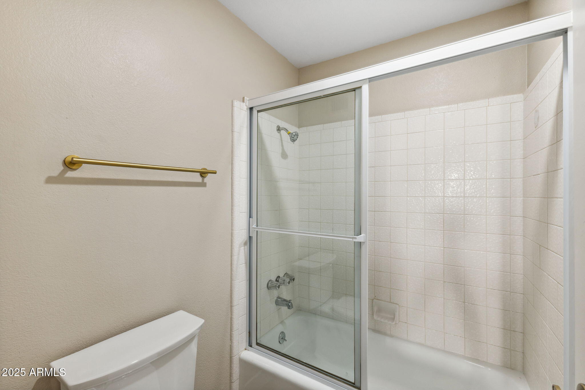 5310 North 24th Place Phoenix, AZ 85016 - Photo 25 of 35 a bathroom with a glass shower door