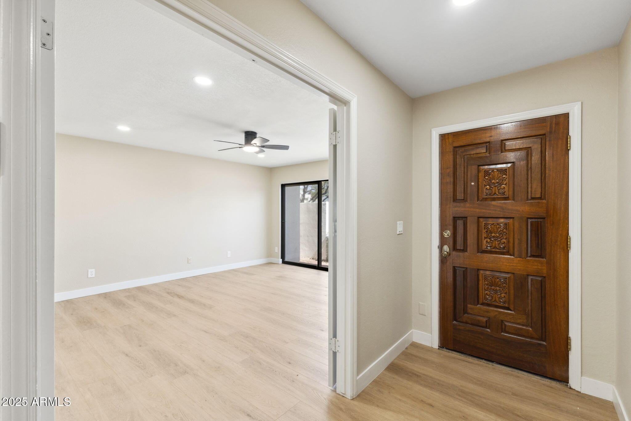 5310 North 24th Place Phoenix, AZ 85016 - Photo 3 of 35 an empty room with closet and wooden floor