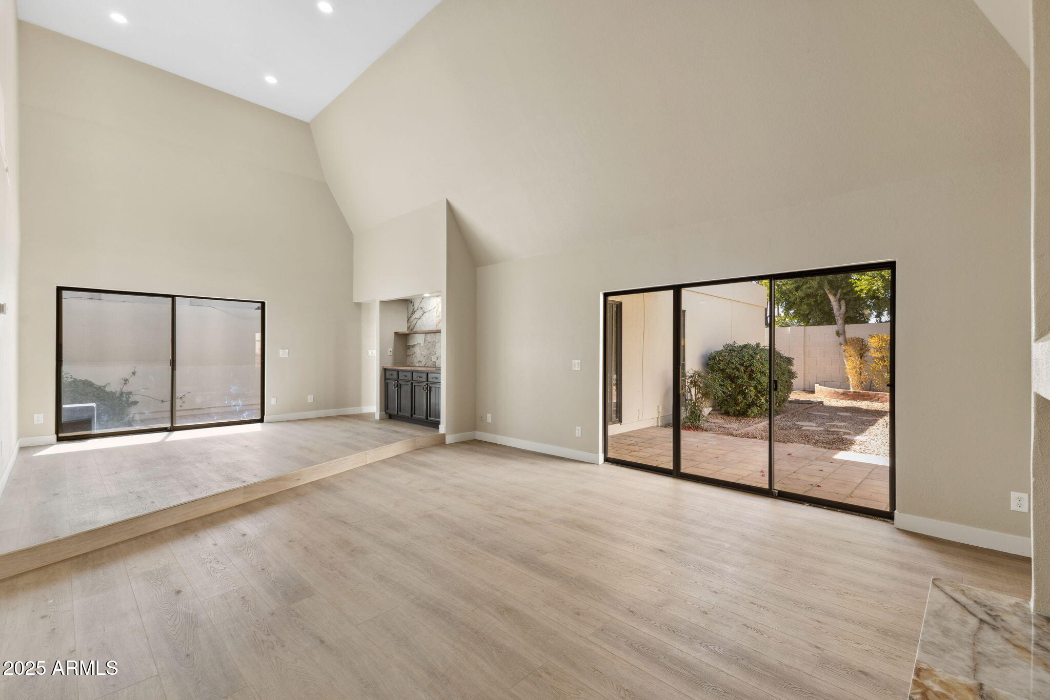 5310 North 24th Place Phoenix, AZ 85016 - Photo 7 of 35 a view of an empty room with a window