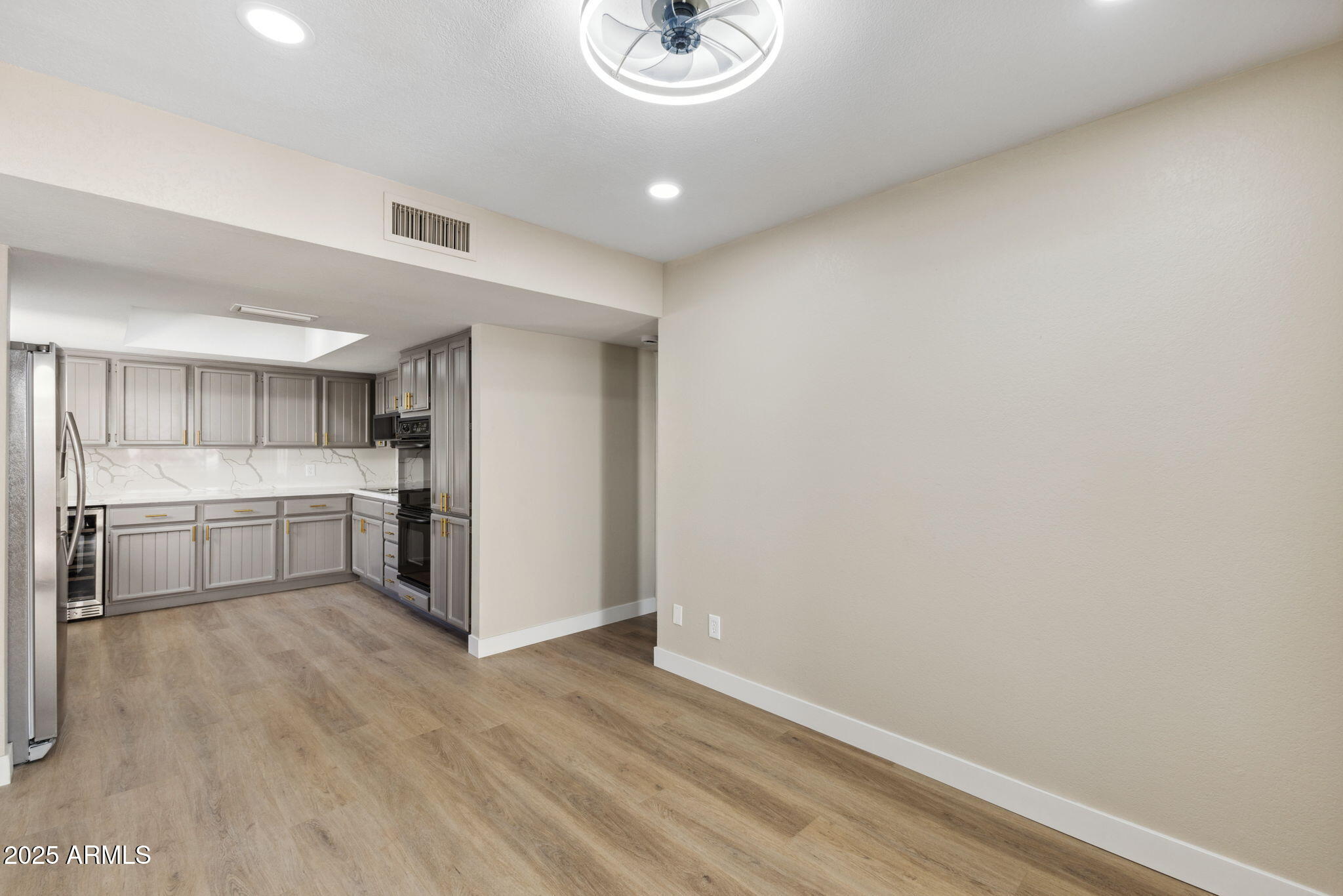 5310 North 24th Place Phoenix, AZ 85016 - Photo 9 of 35 a view of a kitchen with a sink and a refrigerator