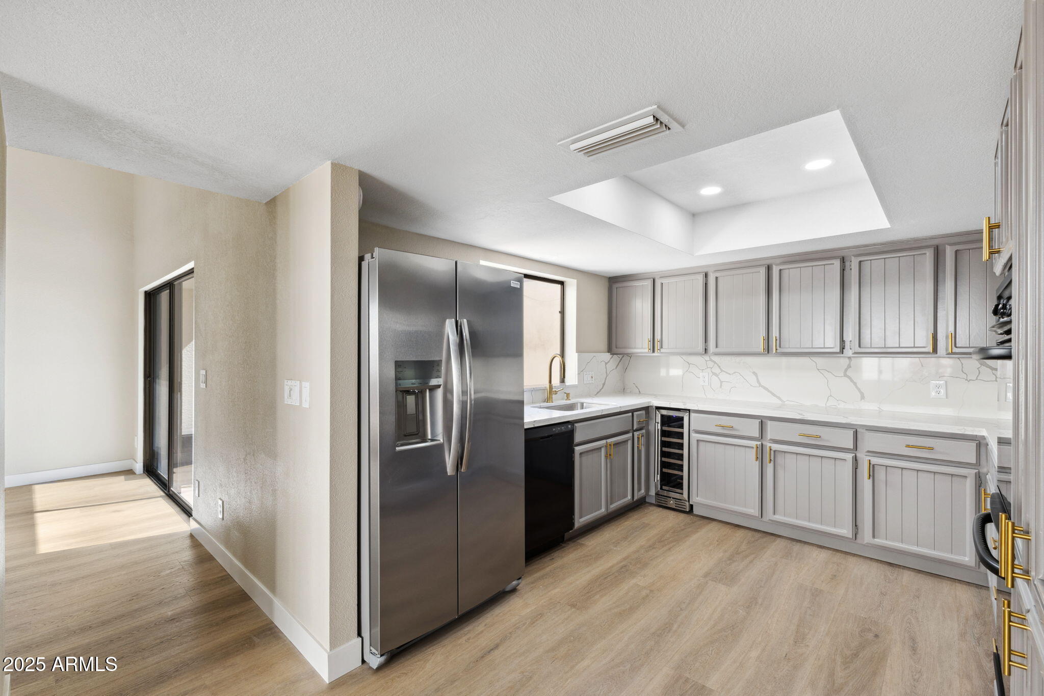 5310 North 24th Place Phoenix, AZ 85016 - Photo 10 of 35 a kitchen with stainless steel appliances granite countertop a refrigerator and a sink