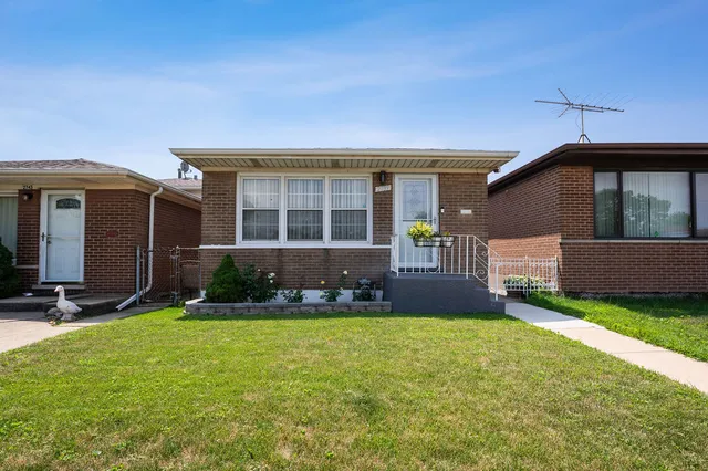 front view of a house with a yard