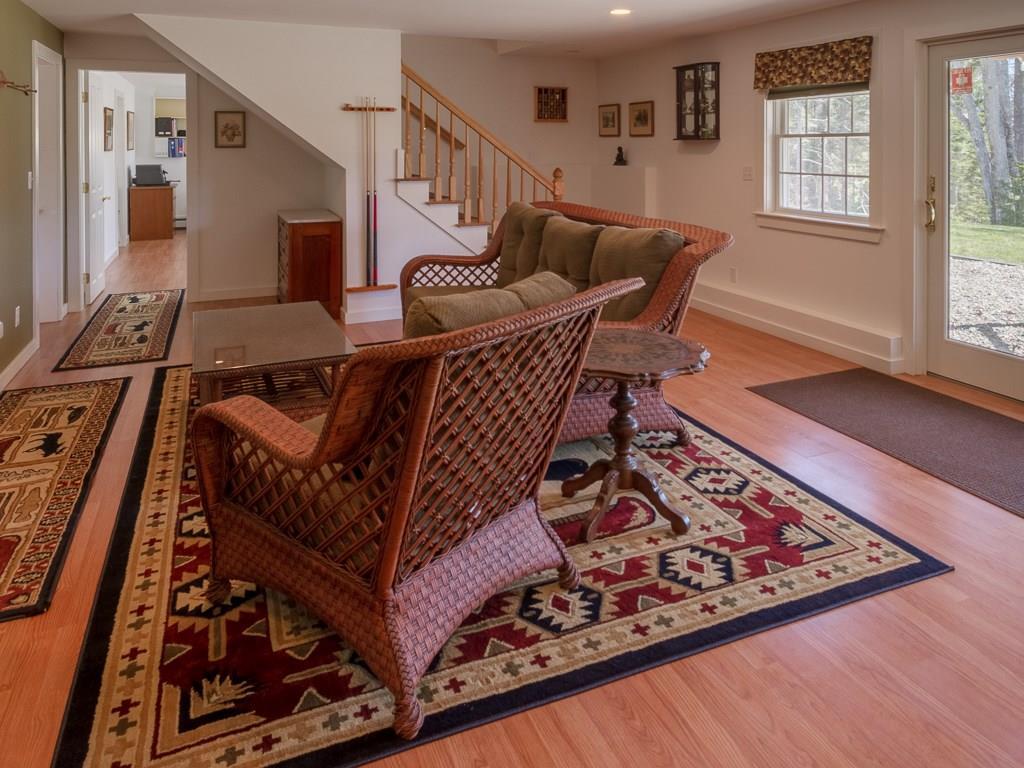 86 Spring Hill Loop Chamberlain, ME 04541 - Photo 21 of 35 Family room in walkout basement.