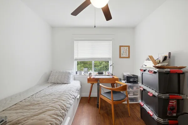 a bedroom with furniture and a window