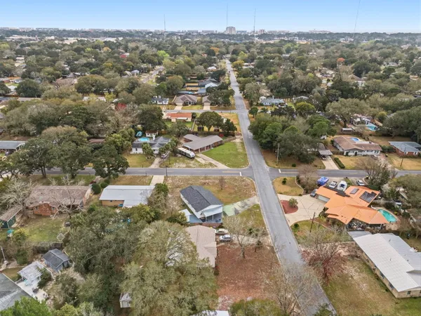 an aerial view of residential houses with outdoor space