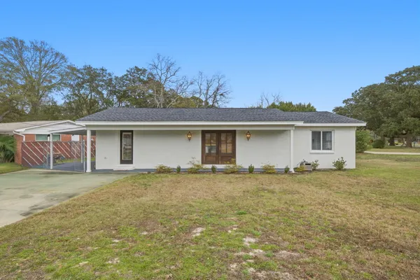 front view of a house with a yard