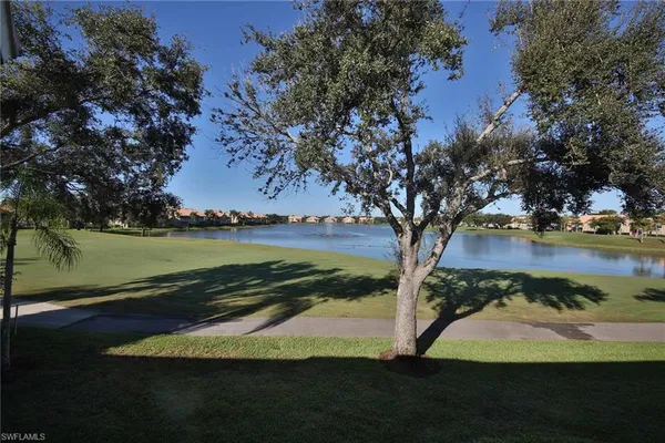 a view of a lake with a yard